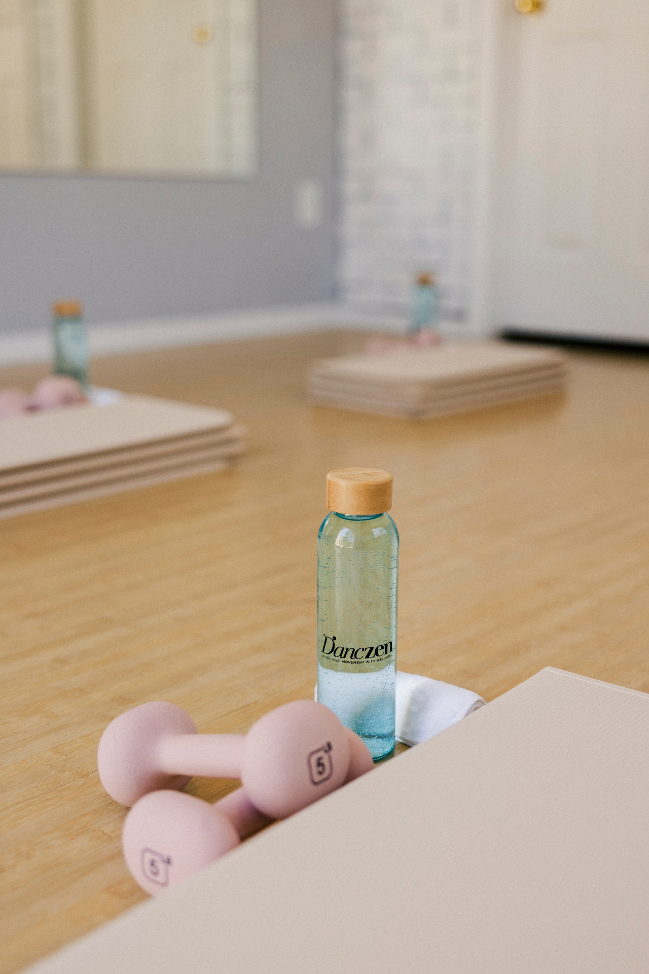 Bottle and weights on the studio floor